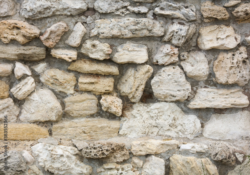 Stones in the wall of the house as an abstract background. Stones in the wall of the house as an abstract background.