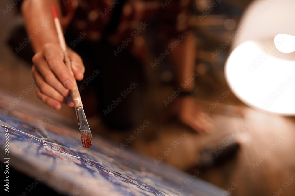 Moving paint brush artist works on abstract oil painting in creative modern studio. Abstract Modern Art. Moving paint brush artist works on abstract oil painting in creative modern studio. Abstract Modern Art.