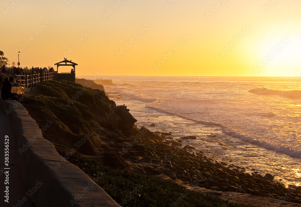 People Watching Sunset on Rocky Beach at La Jolla Cove, La Jolla, California, USA People Watching Sunset on Rocky Beach at La Jolla Cove, La Jolla, California, USA