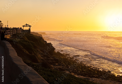 People Watching Sunset on Rocky Beach at La Jolla Cove, La Jolla, California, USA