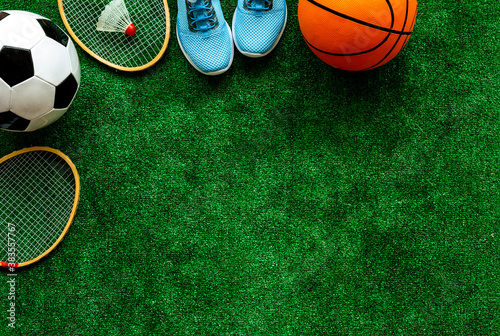 Fototapeta Naklejka Na Ścianę i Meble -  Sport games background - basketball, soccer ball, rackets, sneakers - copy space
