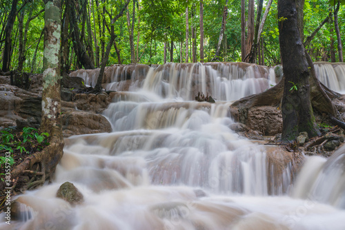 Waterfall scene at Pha Tad Waterfalls in rainforest at the Khuean Srinagarindra National Park Kanchanaburi. © CasanoWa Stutio