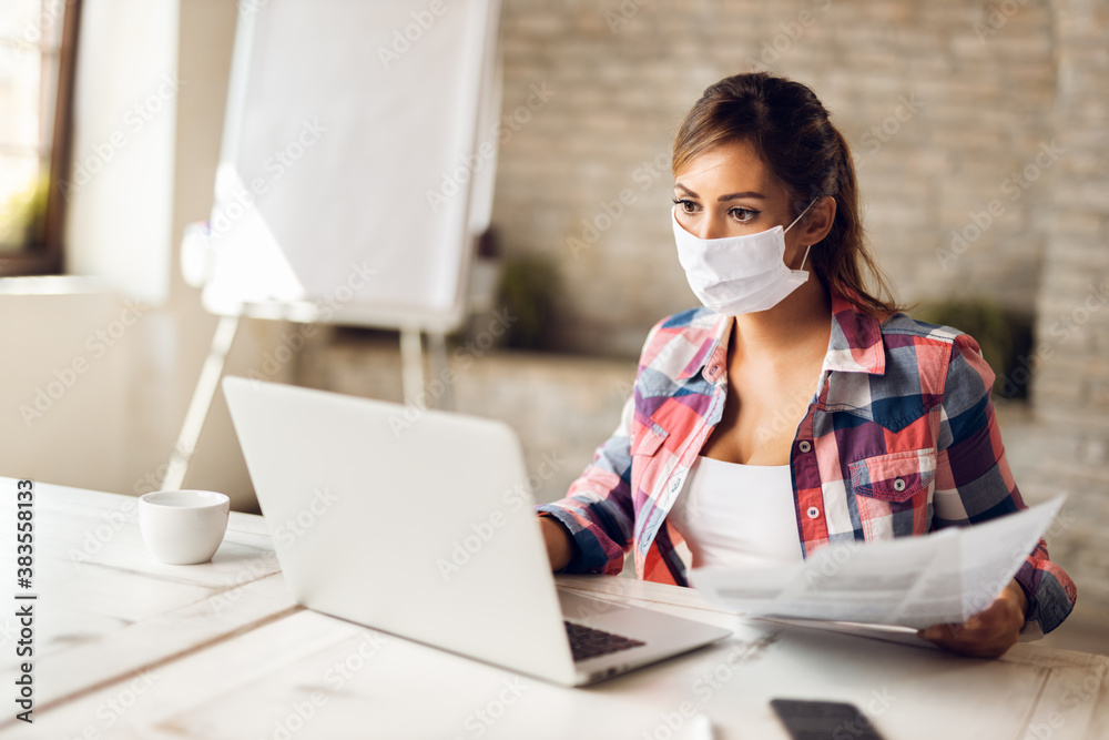 Young businesswoman wears mask while working at casual office Young businesswoman wears mask while working at casual office