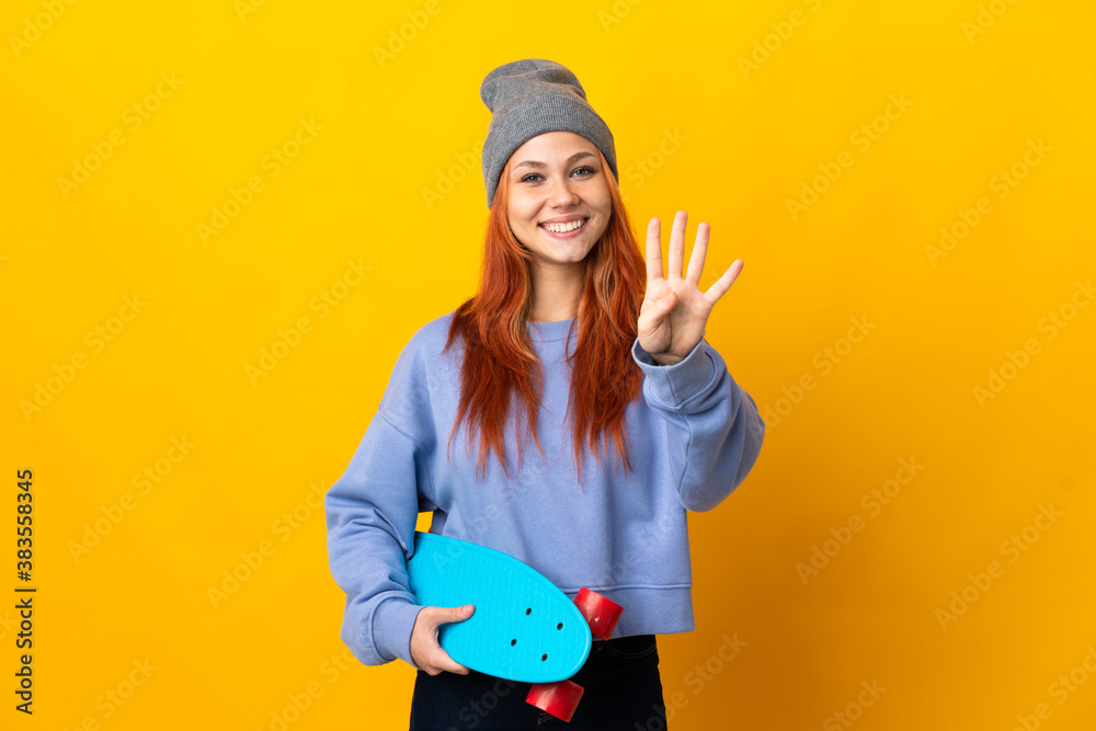 Teenager Russian skater girl isolated on yellow background happy and counting four with fingers Teenager Russian skater girl isolated on yellow background happy and counting four with fingers