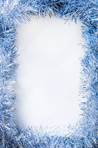 Frame in the form of christmas silver sparkling garland isolated on white background
