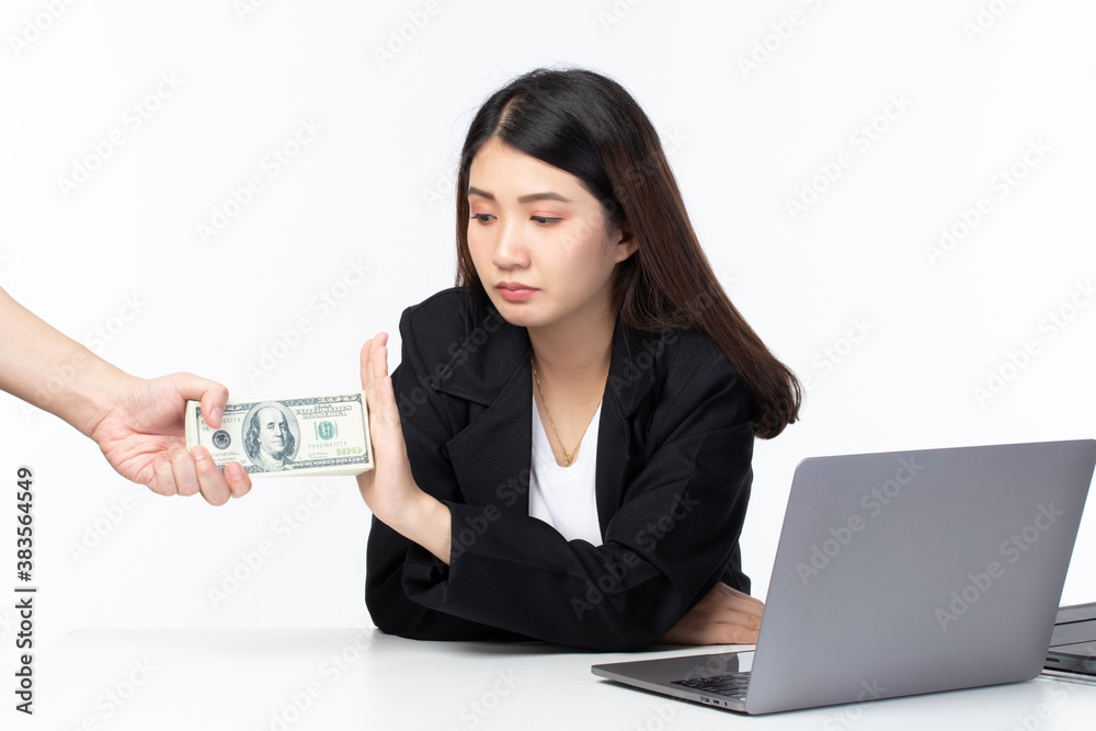 Young business woman refusing money. Anti bribery and corruption concepts. Young business woman refusing money. Anti bribery and corruption concepts.