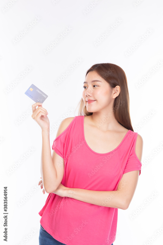 Portrait asian young girl happy and smile shopping online concept. Attractive beautiful asian young woman showing credit card for shopping online, payment on white background with copy space. Portrait asian young girl happy and smile shopping online concept. Attractive beautiful asian young woman showing credit card for shopping online, payment on white background with copy space.