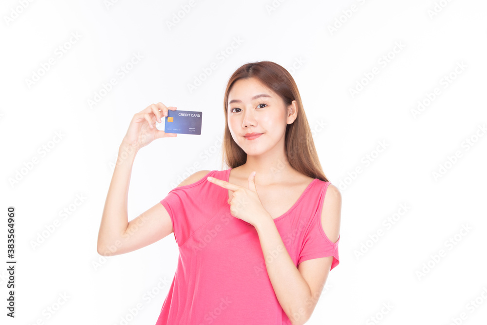 Portrait asian young girl happy and smile shopping online concept. Attractive beautiful asian young woman showing credit card for shopping online, payment isolated on white background with copy space. Portrait asian young girl happy and smile shopping online concept. Attractive beautiful asian young woman showing credit card for shopping online, payment isolated on white background with copy space.