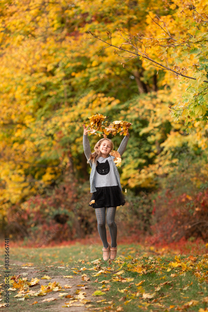 Beautiful little girl with autumn leaves in the park Beautiful little girl with autumn leaves in the park
