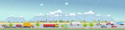 Urban landscape buildings and car. Family houses in town and mountain with green trees in background. Traffic on the road.