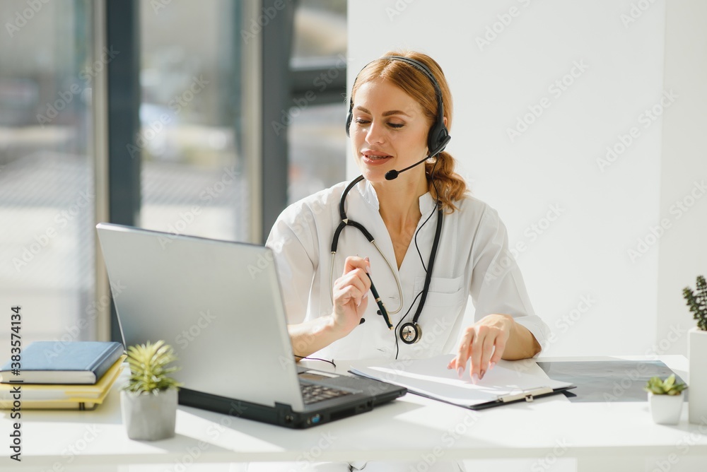 doctor talking with sick person through laptop online system and using mobile digital tablet computer searching patient medical records on the database files document. doctor talking with sick person through laptop online system and using mobile digital tablet computer searching patient medical records on the database files document.