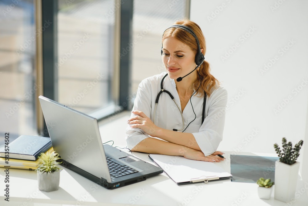 doctor talking with sick person through laptop online system and using mobile digital tablet computer searching patient medical records on the database files document. doctor talking with sick person through laptop online system and using mobile digital tablet computer searching patient medical records on the database files document.