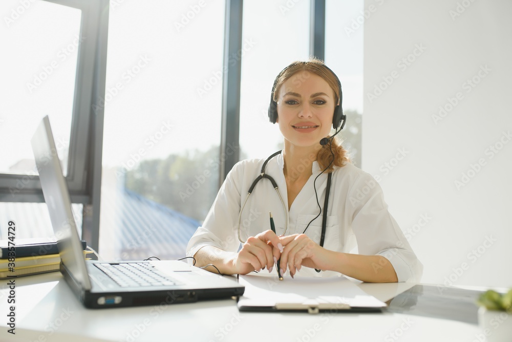 doctor talking with sick person through laptop online system and using mobile digital tablet computer searching patient medical records on the database files document. doctor talking with sick person through laptop online system and using mobile digital tablet computer searching patient medical records on the database files document.