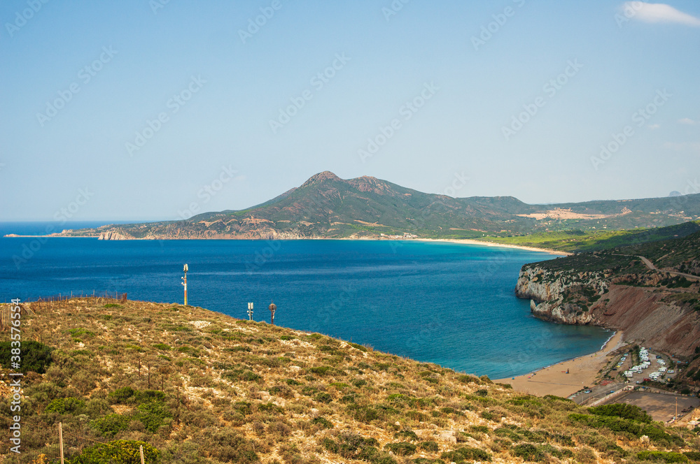 summer beach and mountains. blue sea water at sardinian bay. Costa Verde, Italy