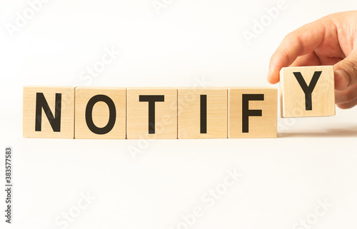 Fototapeta Naklejka Na Ścianę i Meble -  Word notify. Wooden small cubes with letters isolated on white background with copy space available.Business Concept image.