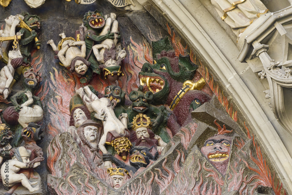 sculpture of the Last Judgment on the tympanum of the main portal of the cathedral, in Bern, Switzerland