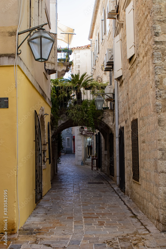 Old city. Narrow street between old stone houses