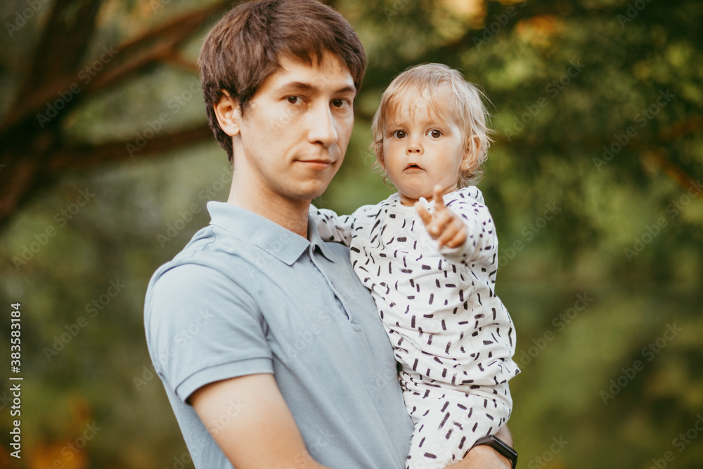 happy family father and son walking in nature happy family father and son walking in nature