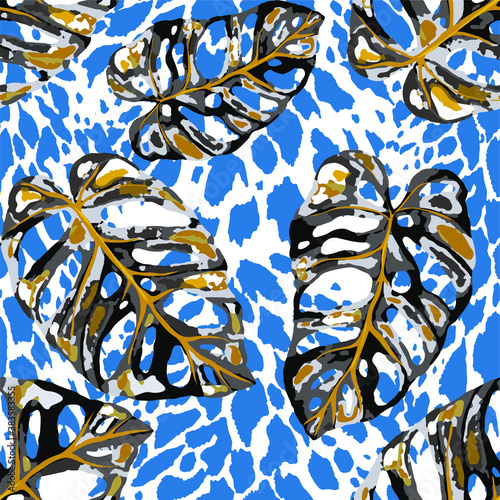 Tropical seamless pattern on animalistic texture. Jungle exotic summer print. Summer tropical leaf. Tropical flower fashion pattern. Floral tropic illustration. Vector seamless pattern.