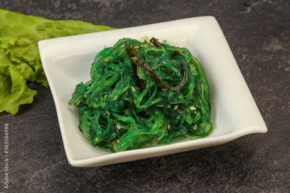 Green Chuka Seaweed Salad Isolated on White Background Top View. Wakame Sea Kelp Salat