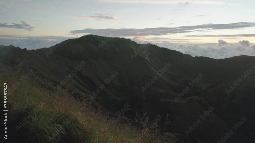 Volcano Mount Batur located at the center of two concentric calderas of Mount Agung on the island of Bali, Indonesia. Mount Batur Sunrise Trekking - is one of the most popular travel destination. Volcano Mount Batur located at the center of two concentric calderas of Mount Agung on the island of Bali, Indonesia. Mount Batur Sunrise Trekking - is one of the most popular travel destination.