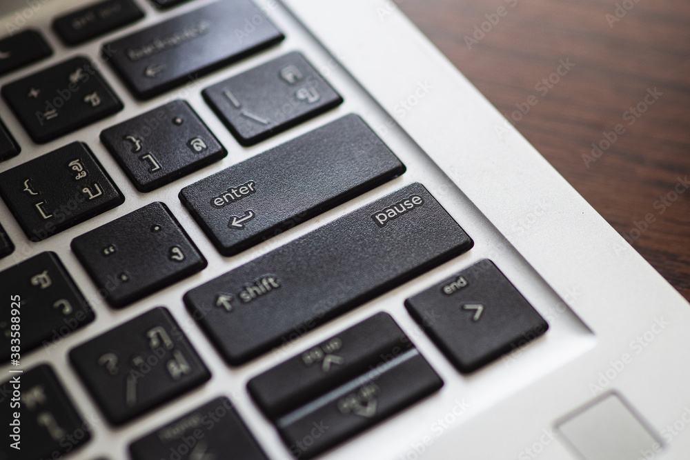 Close up of black computer keyboard in enter and pause key. Selective focus Close up of black computer keyboard in enter and pause key. Selective focus