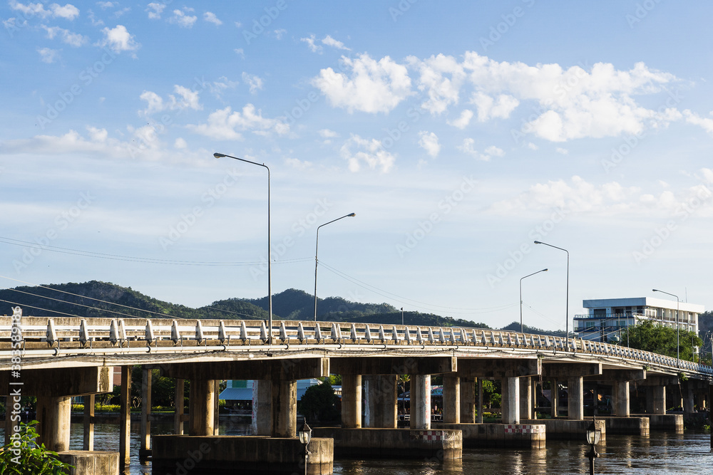 The concrete bridge across the Khwae  river with blue sky, Kanchanaburi province, Thailand.