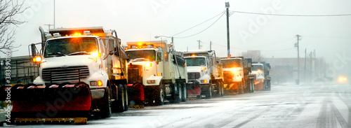 Fotografie Snow Plows in Severe Blizzard Preparing for Storm