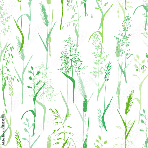 Vector seamless pattern with grass silhouettes in green colors