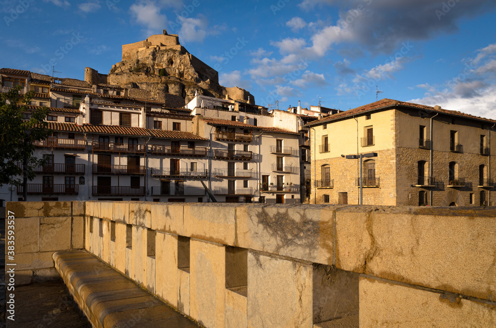 Streets of Morella with the castle on the top of the mountain at sunset, Castellon, Spain