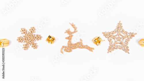 Christmas background of golden star and golden reindeer decorations on white background