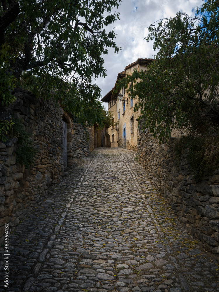 Cobbled streets and stone houses in the medieval village of Mirambel, Teruel , Spain Cobbled streets and stone houses in the medieval village of Mirambel, Teruel , Spain