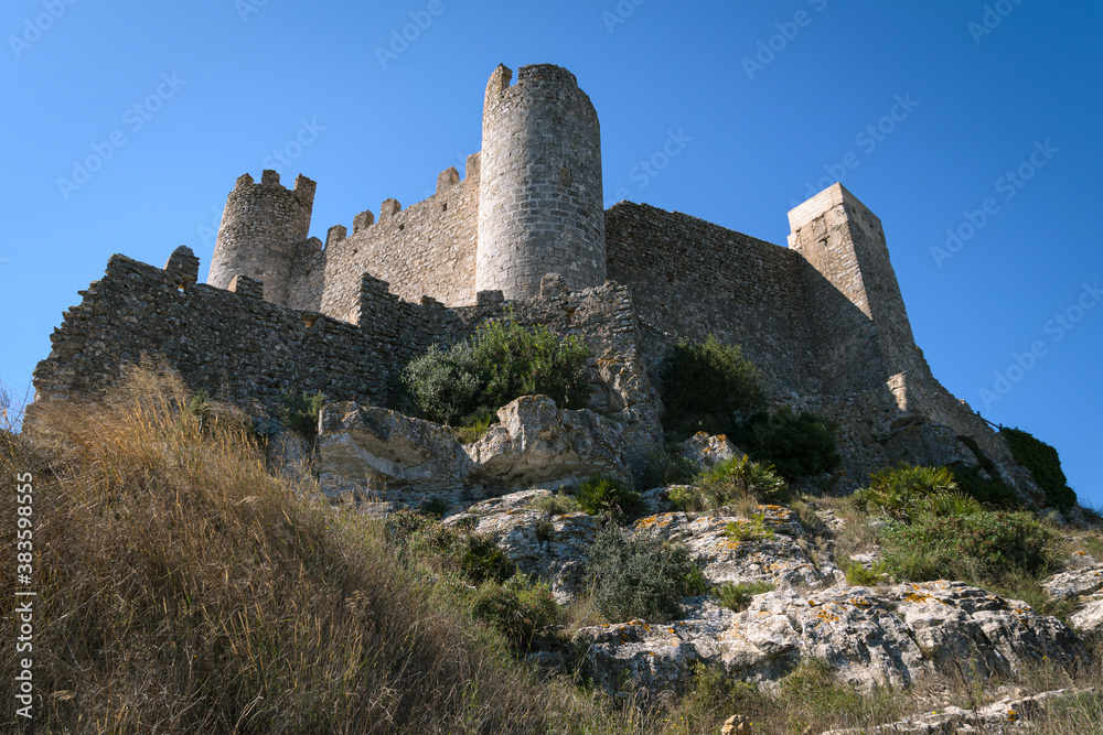 Medieval castle of Alcala de Chivert on a day with blue sky, Castellon, Spain
