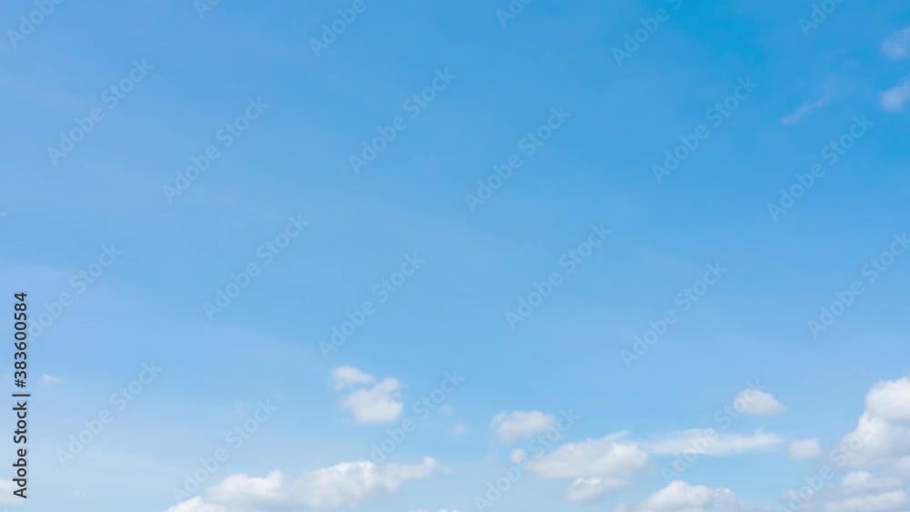 Time-lapse of lot fluffy cumulus clouds moving in half screen in horizontal in clear soft blue sky. Clean energy or environmental conservation for concept, skycaps Background Time-lapse of lot fluffy cumulus clouds moving in half screen in horizontal in clear soft blue sky. Clean energy or environmental conservation for concept, skycaps Background