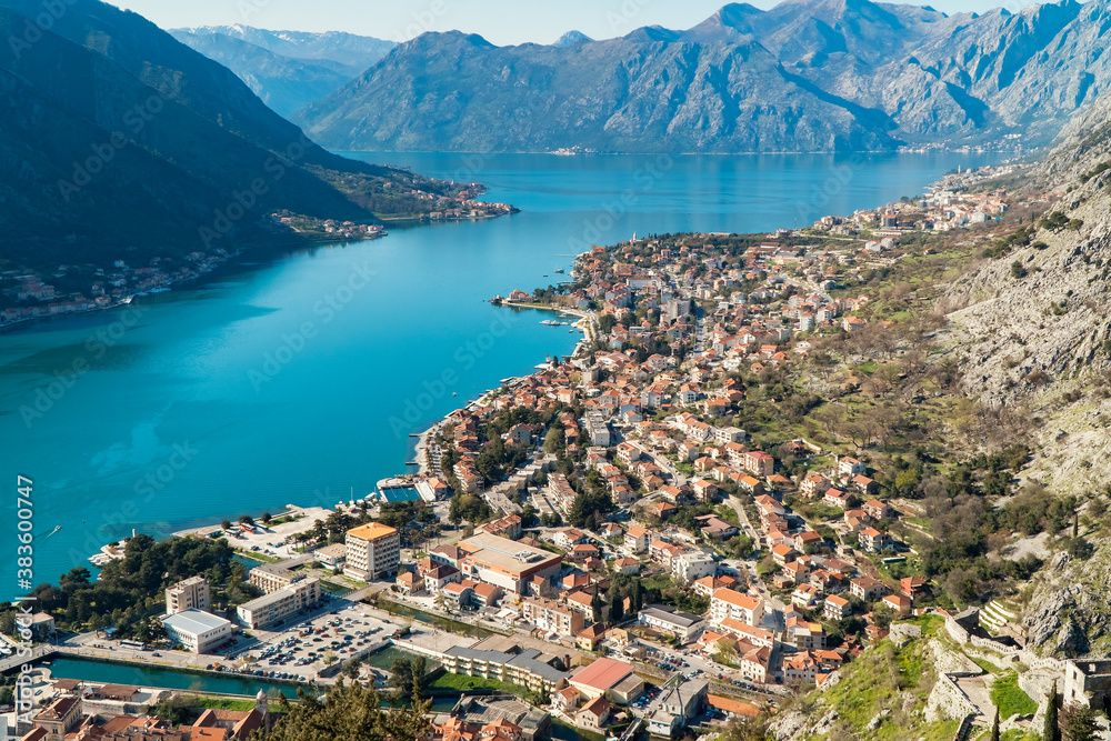 Beautiful  panoramic view of Dobrota Bay in Kotor and Old Town in a sunny day. Kotor is very popular city for   tourists and has a pier for cruise ships.