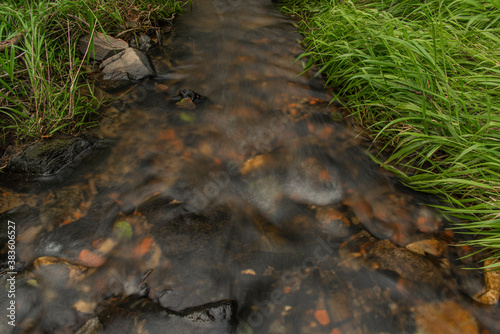 Zborovsky creek flowing to influence with Malse river in autumn day photo
