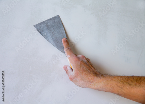 Картината върху платно Plastering wall with plaste and plaster spatula trowel