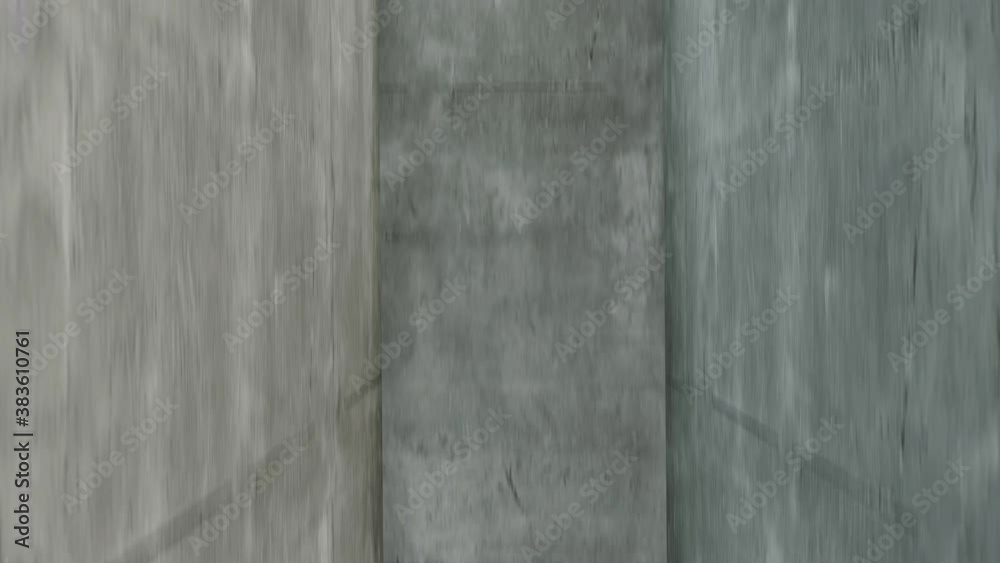 The view from inside a newly built concrete elevator shaft as it lifts from the ground up. The view from inside a newly built concrete elevator shaft as it lifts from the ground up.