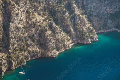 Landspace with boat and sea in butterfly valley. The high view of Butterfly valley. View of the coast of island.