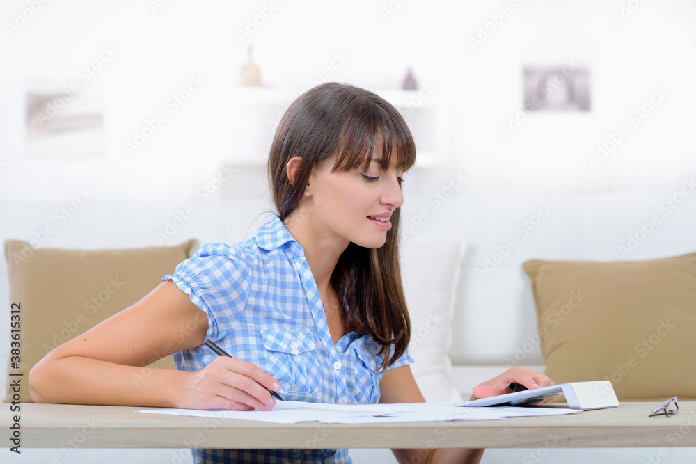 busy university student doing her assignment busy university student doing her assignment