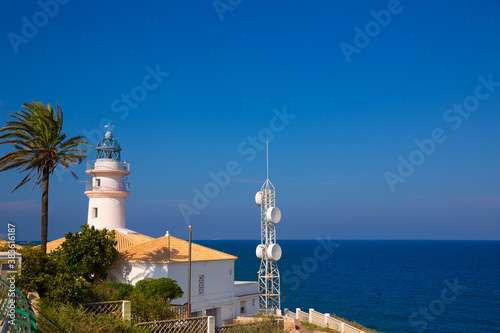 Cullera lighthouse in Valencia at Mediterranean sea photo