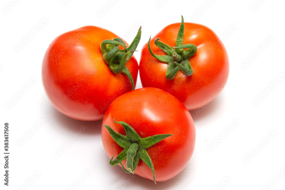 Bright red ripe tomatoes with ponytails isolated on white background Bright red ripe tomatoes with ponytails isolated on white background