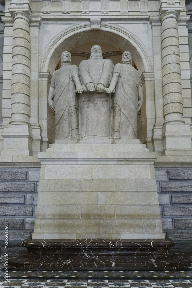 The statue of the Three Confederates swearing an oath on the Rütli meadow in Federal Palace of Switzerland, Bern, Switzerland The statue of the Three Confederates swearing an oath on the Rütli meadow in Federal Palace of Switzerland, Bern, Switzerland