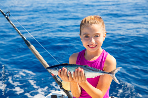Принти на полотні kid girl fishing tuna bonito sarda fish happy with catch