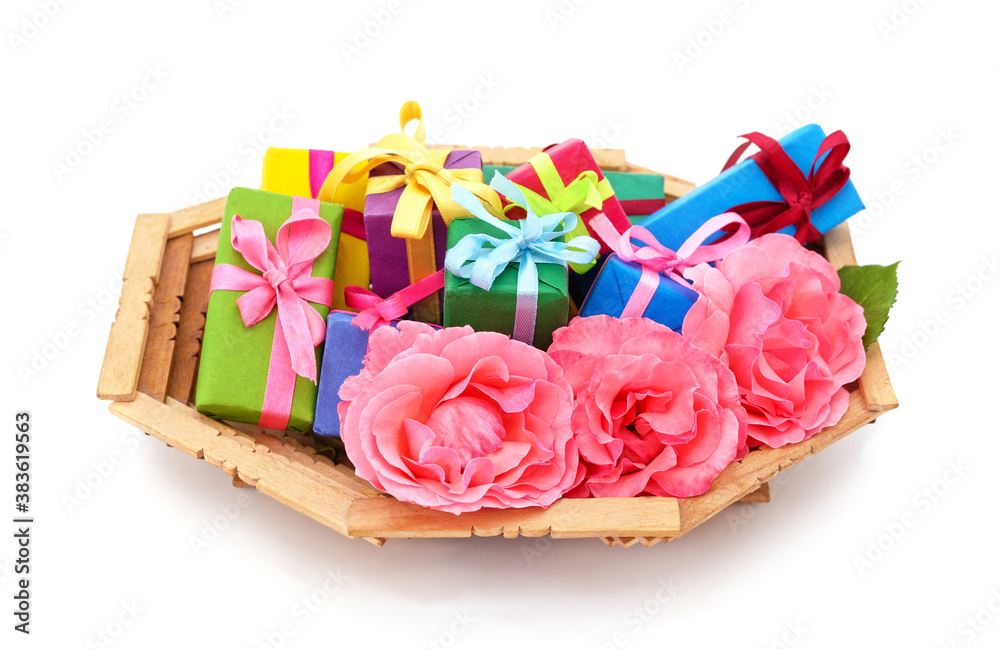 Gifts and roses in a basket. Gifts and roses in a basket.