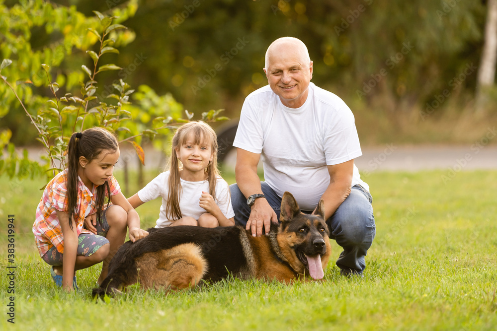 Grandfather And Granddaughters Taking Dog For Walk Grandfather And Granddaughters Taking Dog For Walk