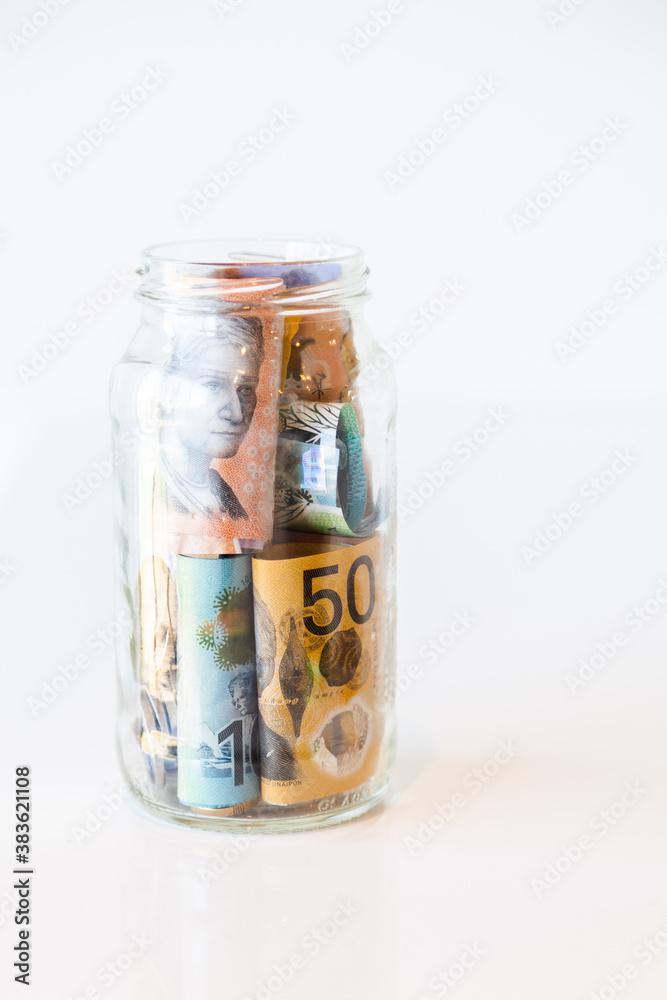 Jar of Australian currency notes and coins Jar of Australian currency notes and coins