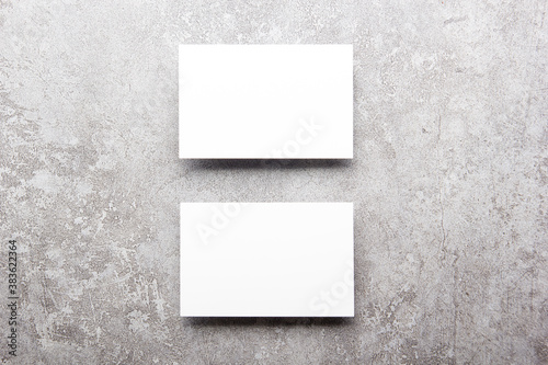 White business cards blank on textured background. Identity design, corporate templates, company style. Flat lay
