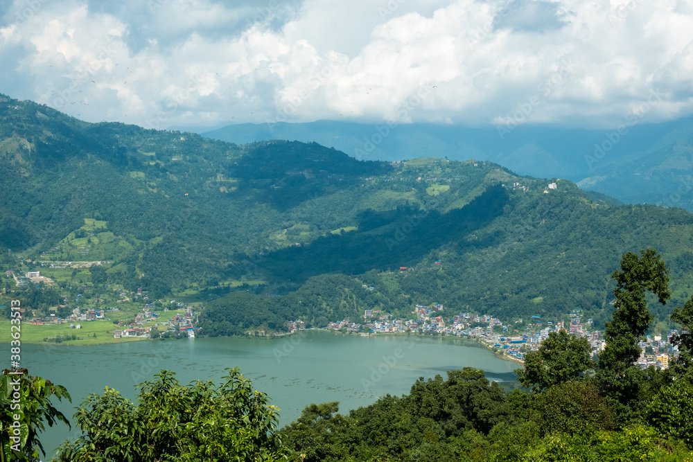 Aerial view of the Lakeside area in Pokhara city, Nepal, with the surrounding hills and Phewa Lake