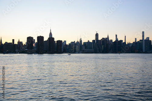 New York  NY  USA - June 27  2019  Manhattan view from the ferry which follows to 34th Street from Brooklyn Bridge Park